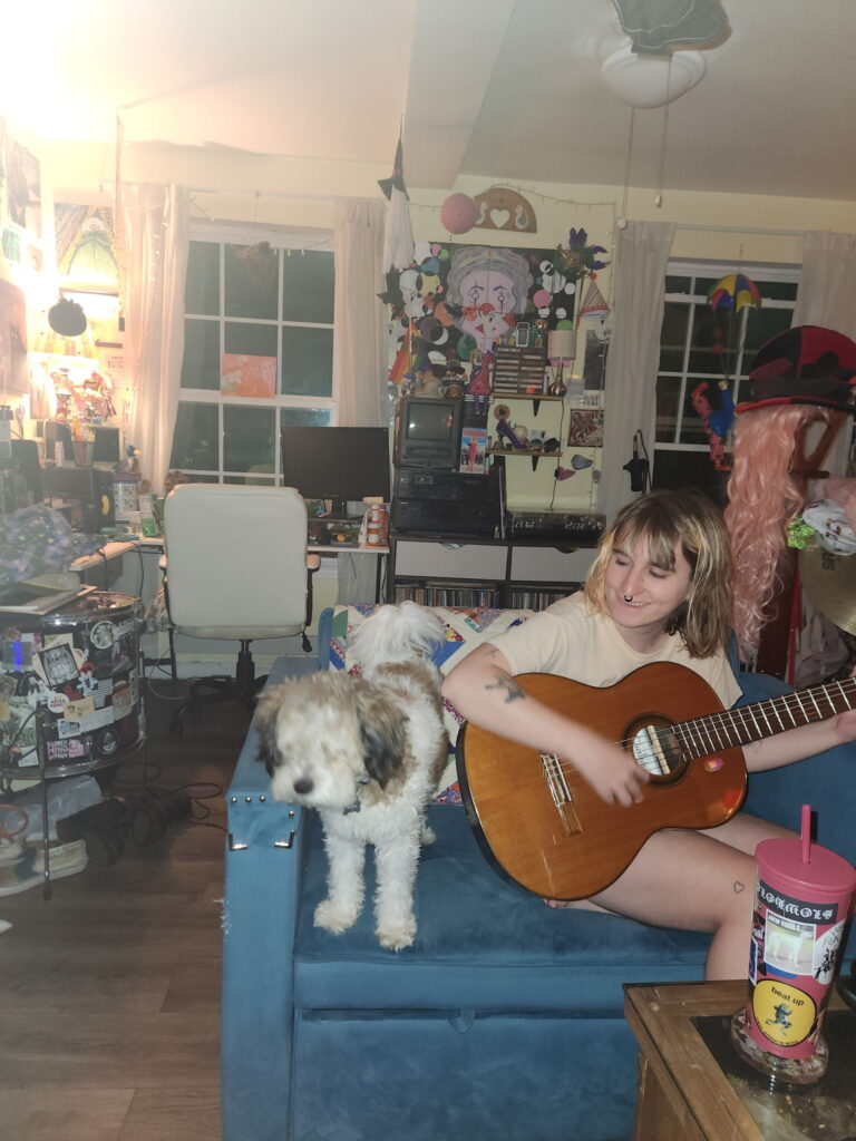 the musician mowmowmow playing guitar